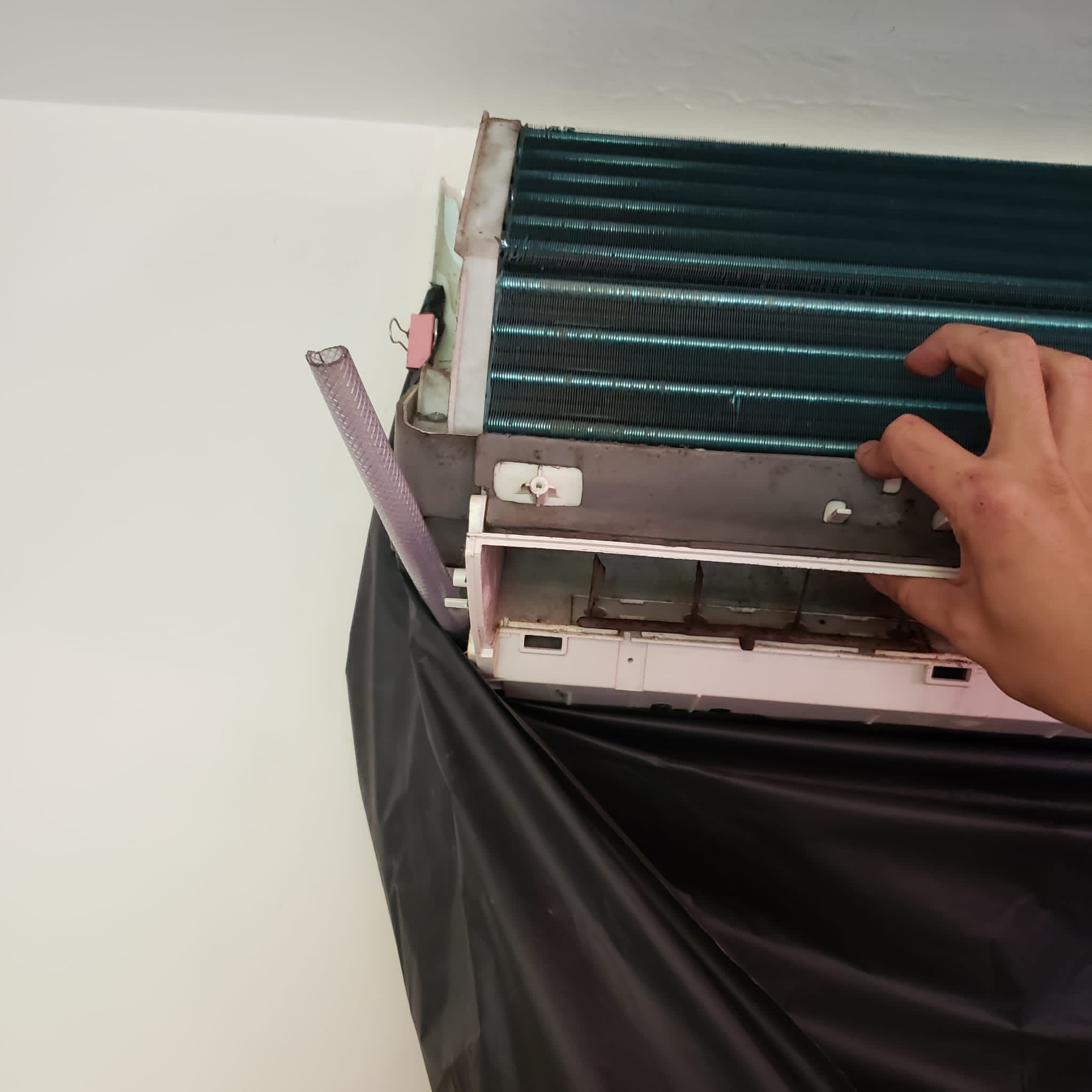 Wall mounted air conditioner cleaning job at a residential unit in Ngau